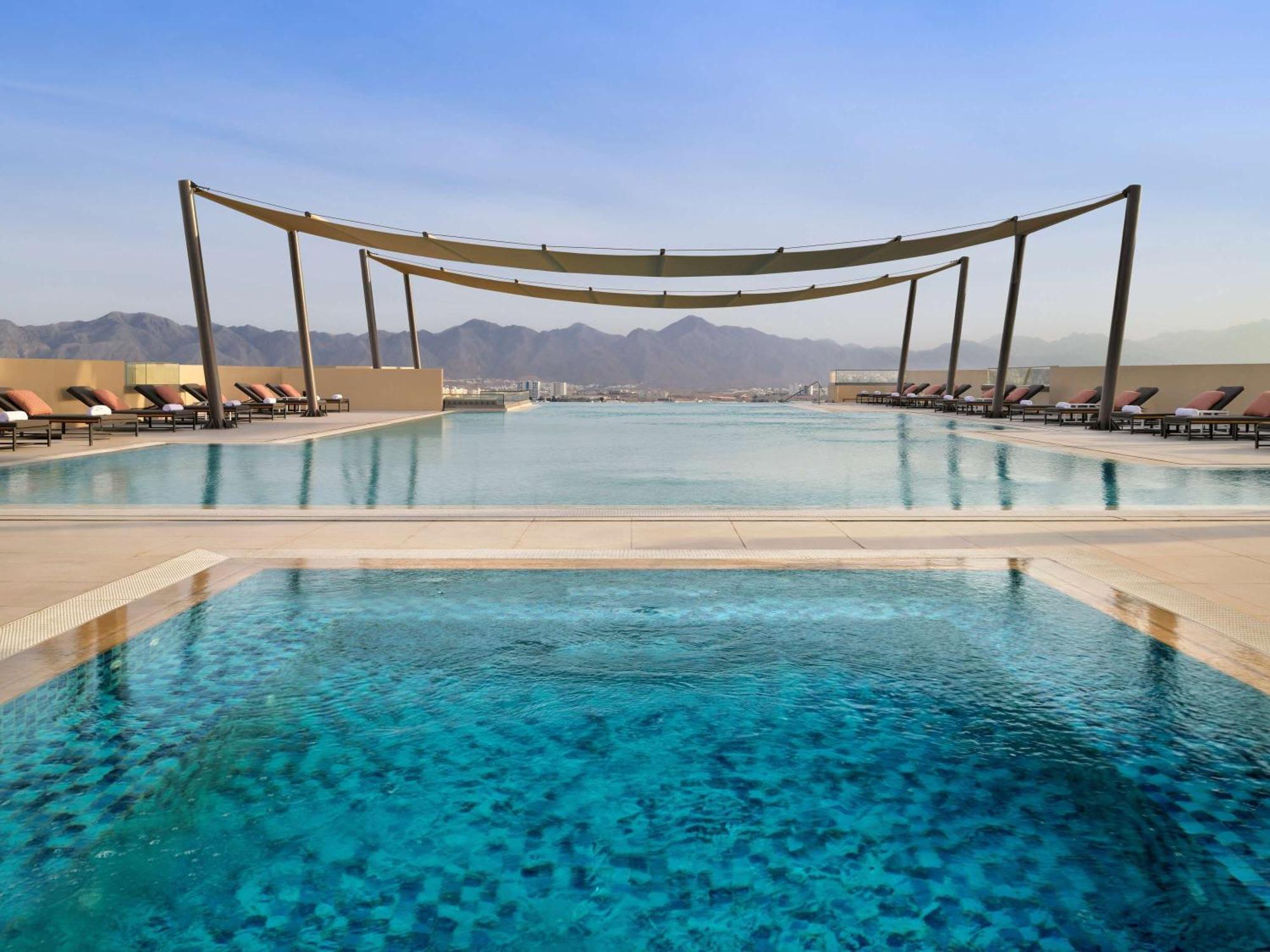 Moevenpick Hotel & Apartments Ghala Muscat Exteriör bild The pool at the hotel