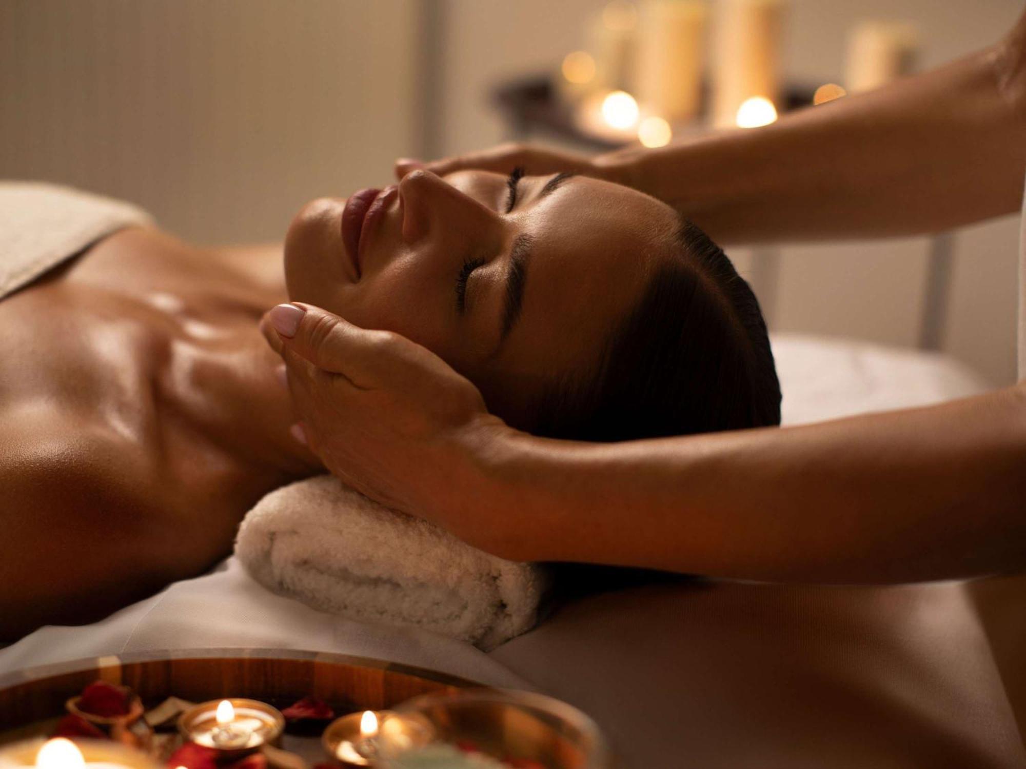 Moevenpick Hotel & Apartments Ghala Muscat Exteriör bild A woman receiving a facial massage
