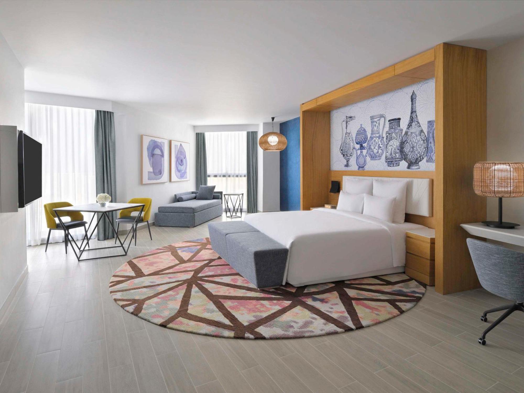 Moevenpick Hotel & Apartments Ghala Muscat Exteriör bild A room at the hotel